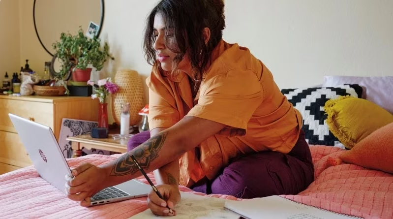 Student using an HP laptop while studying at home